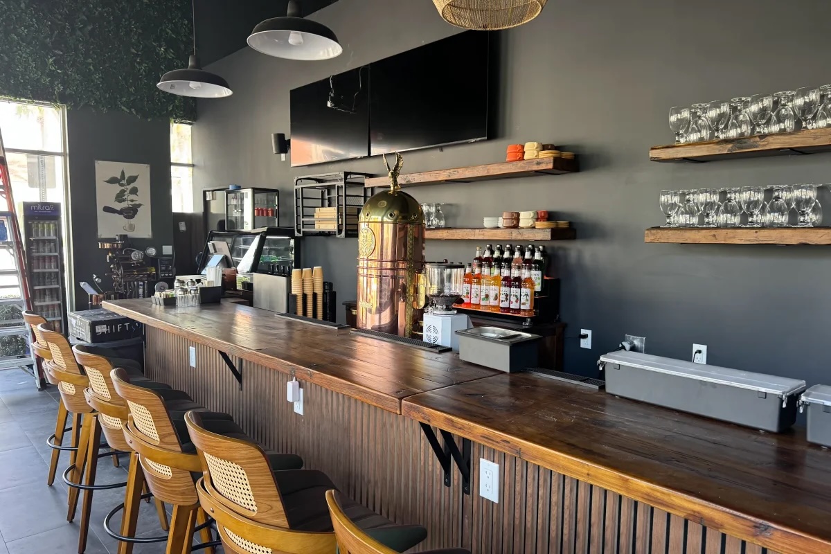 Interior of the Roast & Rush bar with wooden counter and stools
